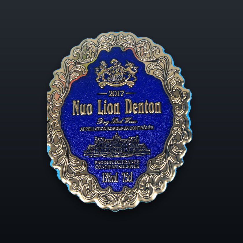 Ornate blue enamel and gold foil wine label